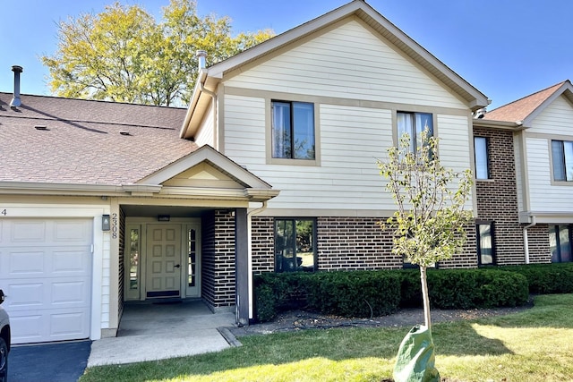 view of front of property with a garage