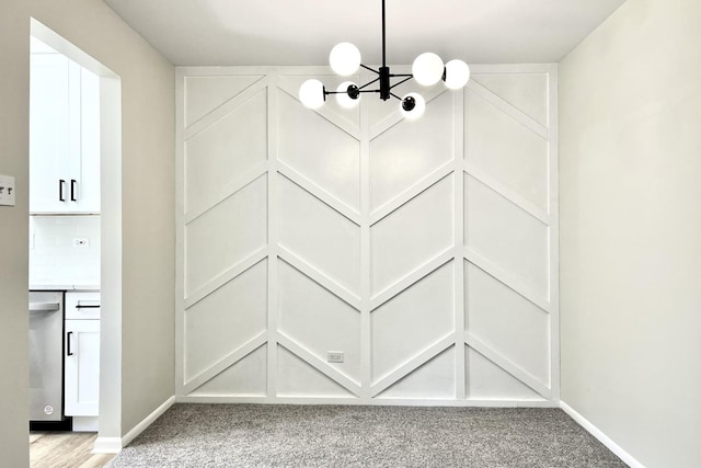 room details featuring dishwasher, tasteful backsplash, and a notable chandelier