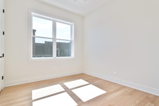 spare room featuring light wood-type flooring