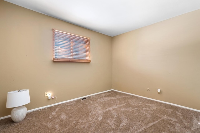 unfurnished room with carpet floors