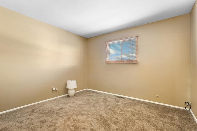 spare room with carpet