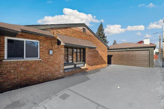 exterior space with a garage and an outdoor structure