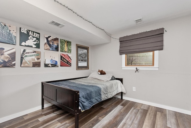 bedroom with wood-type flooring