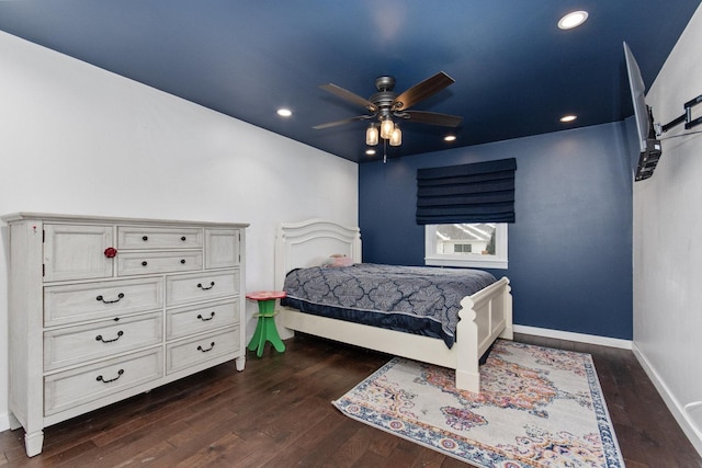 bedroom with ceiling fan and dark wood-type flooring