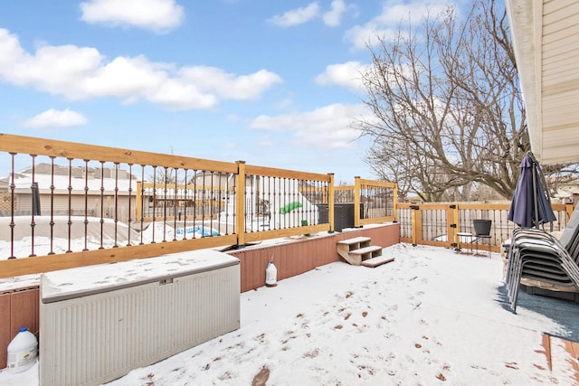 view of snow covered deck