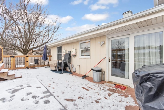 snow covered property featuring a deck