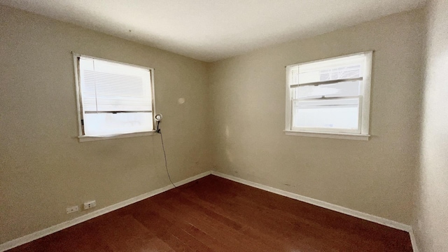 empty room featuring hardwood / wood-style flooring