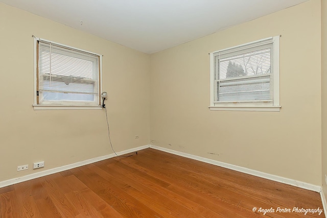 spare room featuring hardwood / wood-style flooring