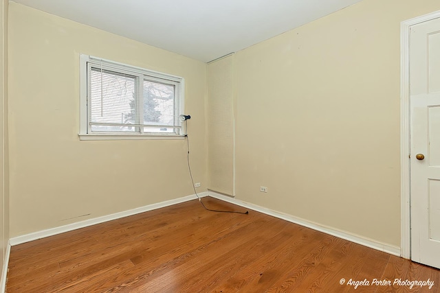 empty room featuring hardwood / wood-style flooring