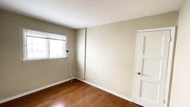 empty room with wood-type flooring