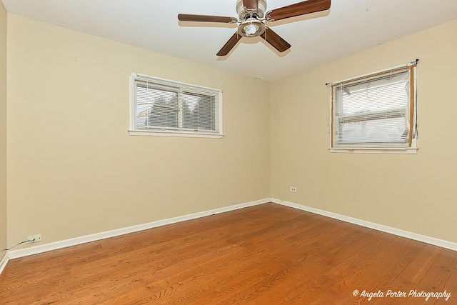 empty room featuring hardwood / wood-style flooring and ceiling fan