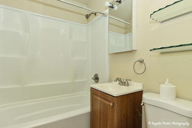 full bathroom with vanity, bathtub / shower combination, and toilet