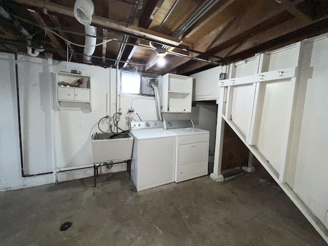 laundry room featuring sink and washer and dryer