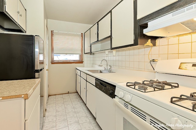 kitchen with tasteful backsplash, white cabinetry, sink, and white appliances