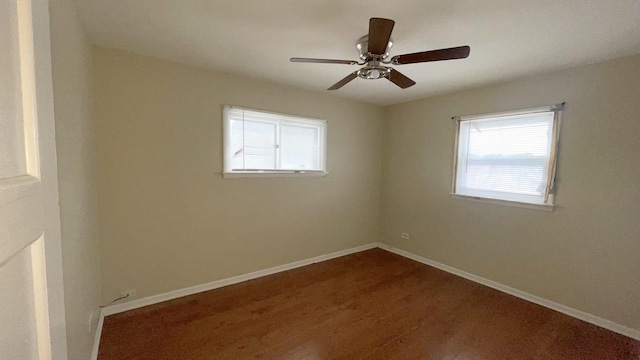 spare room with ceiling fan and wood-type flooring