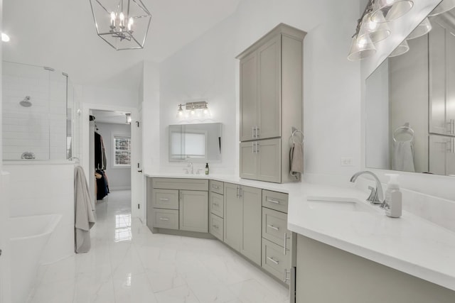 bathroom featuring plus walk in shower, vanity, and a chandelier