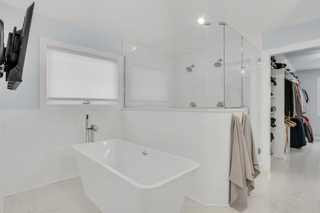 bathroom with separate shower and tub