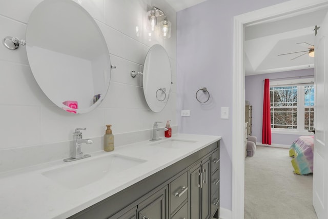 bathroom with ceiling fan and vanity