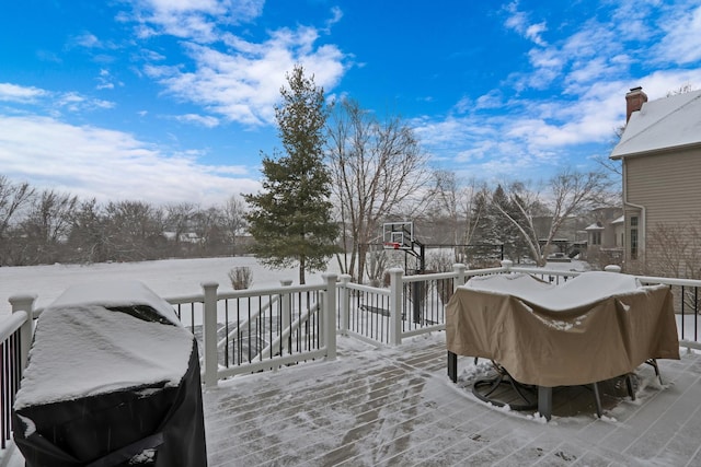 snow covered deck featuring grilling area