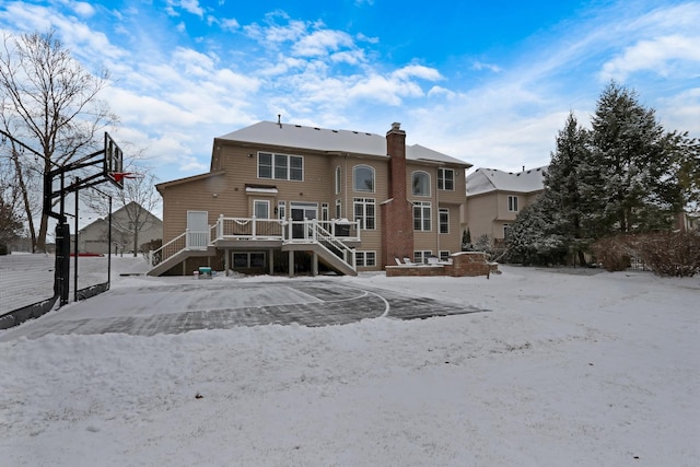 back of house featuring a wooden deck