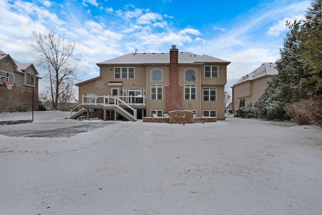 back of property featuring a wooden deck