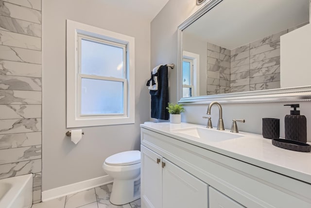 full bathroom featuring vanity, tiled shower / bath combo, and toilet