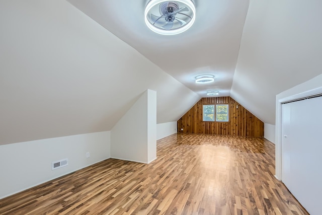 bonus room featuring hardwood / wood-style floors and lofted ceiling