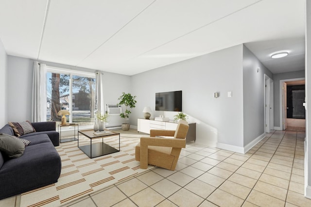 living room featuring light tile patterned floors and a baseboard heating unit