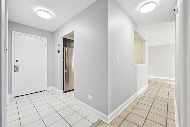 entrance foyer with light tile patterned floors