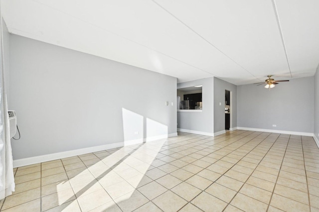 tiled empty room featuring ceiling fan