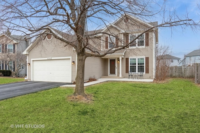 front facade with a garage and a front yard