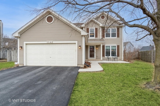 front of property with a garage and a front yard