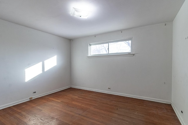 empty room with dark hardwood / wood-style floors