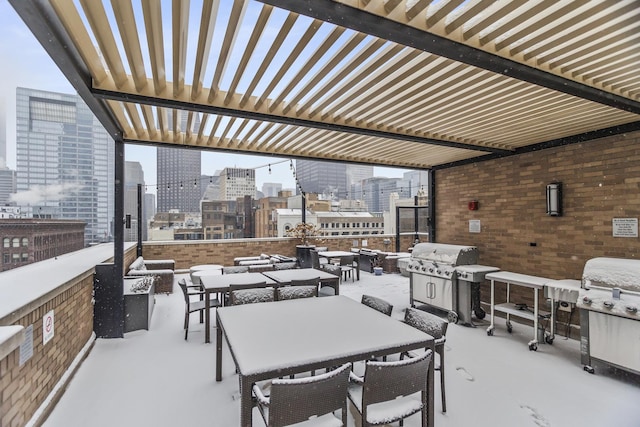 view of patio featuring area for grilling and a pergola