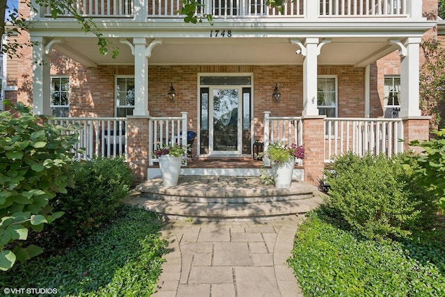 property entrance with covered porch