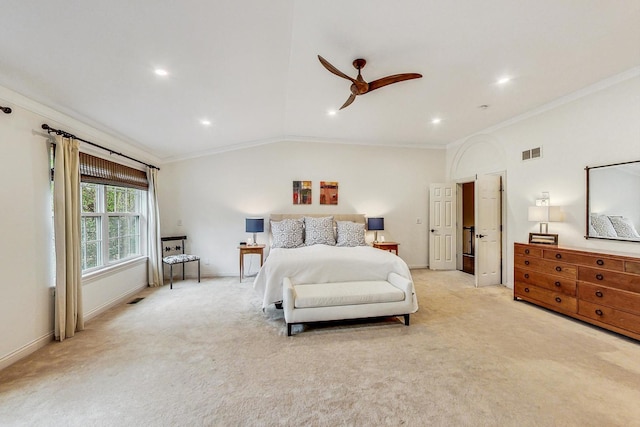 carpeted bedroom with vaulted ceiling, ornamental molding, and ceiling fan