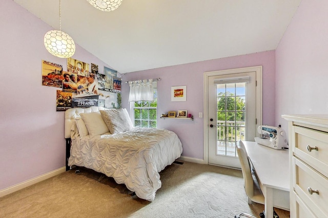 carpeted bedroom with lofted ceiling and access to outside