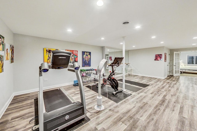 workout area with french doors and wood-type flooring