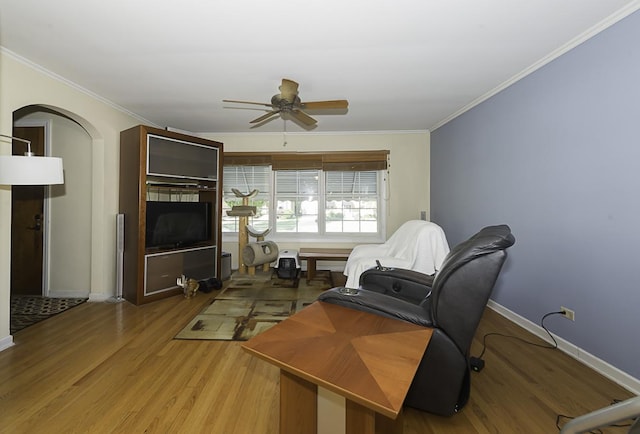 living room featuring hardwood / wood-style flooring, ceiling fan, and ornamental molding