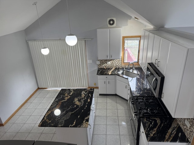 kitchen with decorative backsplash, sink, decorative light fixtures, white cabinets, and lofted ceiling