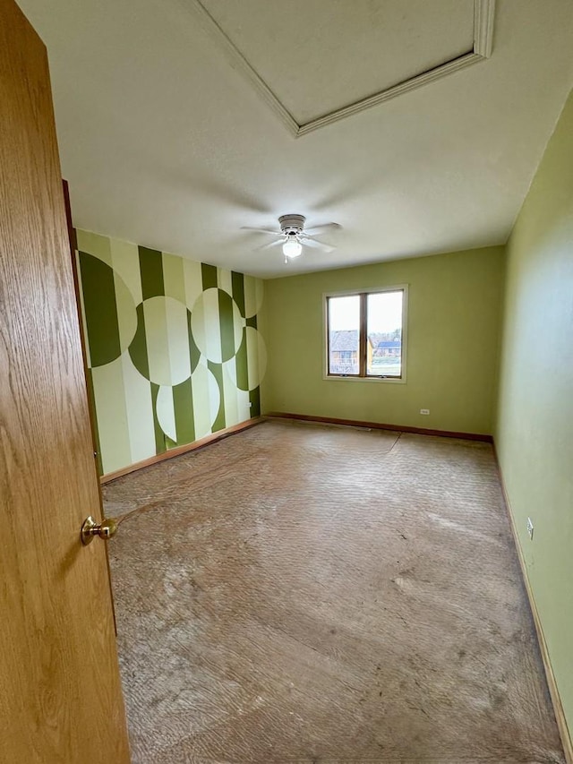 unfurnished room with carpet flooring and ceiling fan