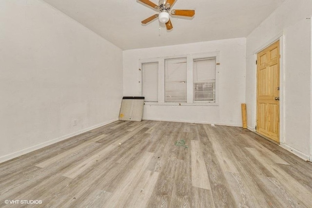 empty room with light hardwood / wood-style floors and ceiling fan