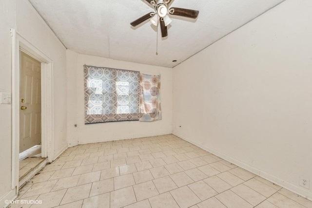 spare room with ceiling fan