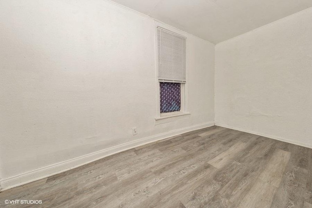 empty room with hardwood / wood-style floors