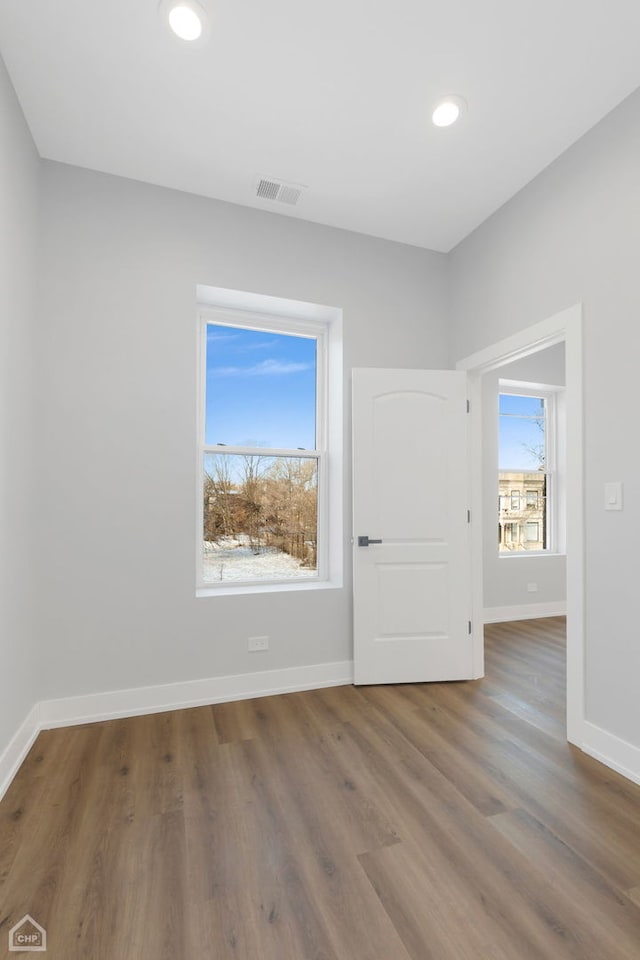 empty room with wood-type flooring