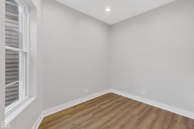 empty room with wood-type flooring