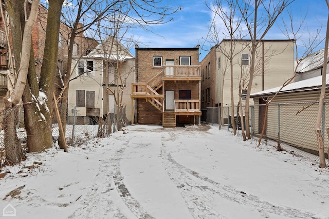 view of snow covered house