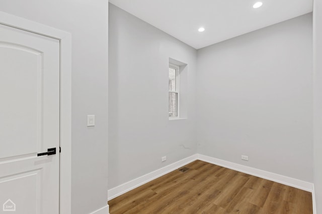 unfurnished room featuring hardwood / wood-style floors