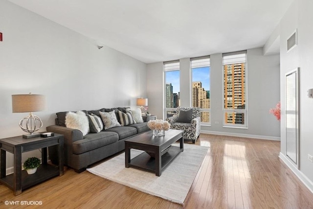 living room with light hardwood / wood-style floors