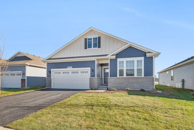 craftsman-style house featuring a front yard and a garage